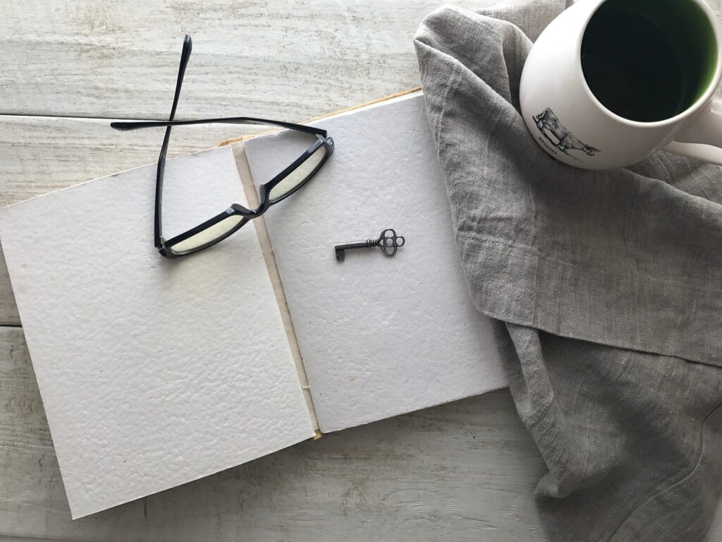 coffee, glasses, open book