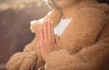 A woman is start praying in the morning for the blessings