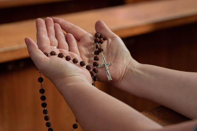 person hands showing praying for blessings