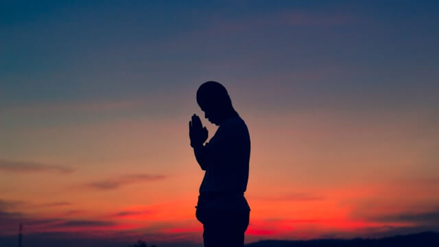 A person praying in the morning for saturday blessings